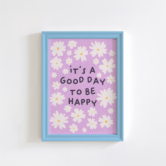 A purple print, with the message 'it's a good day to be happy' surrounded by white daisies.
