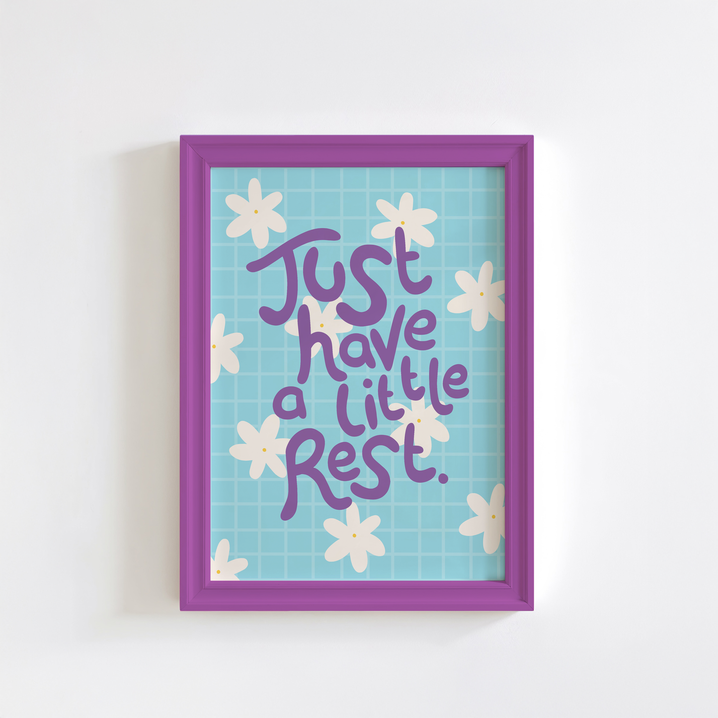 Framed artwork with 'Just have a little rest' text and floral design on a light blue background.