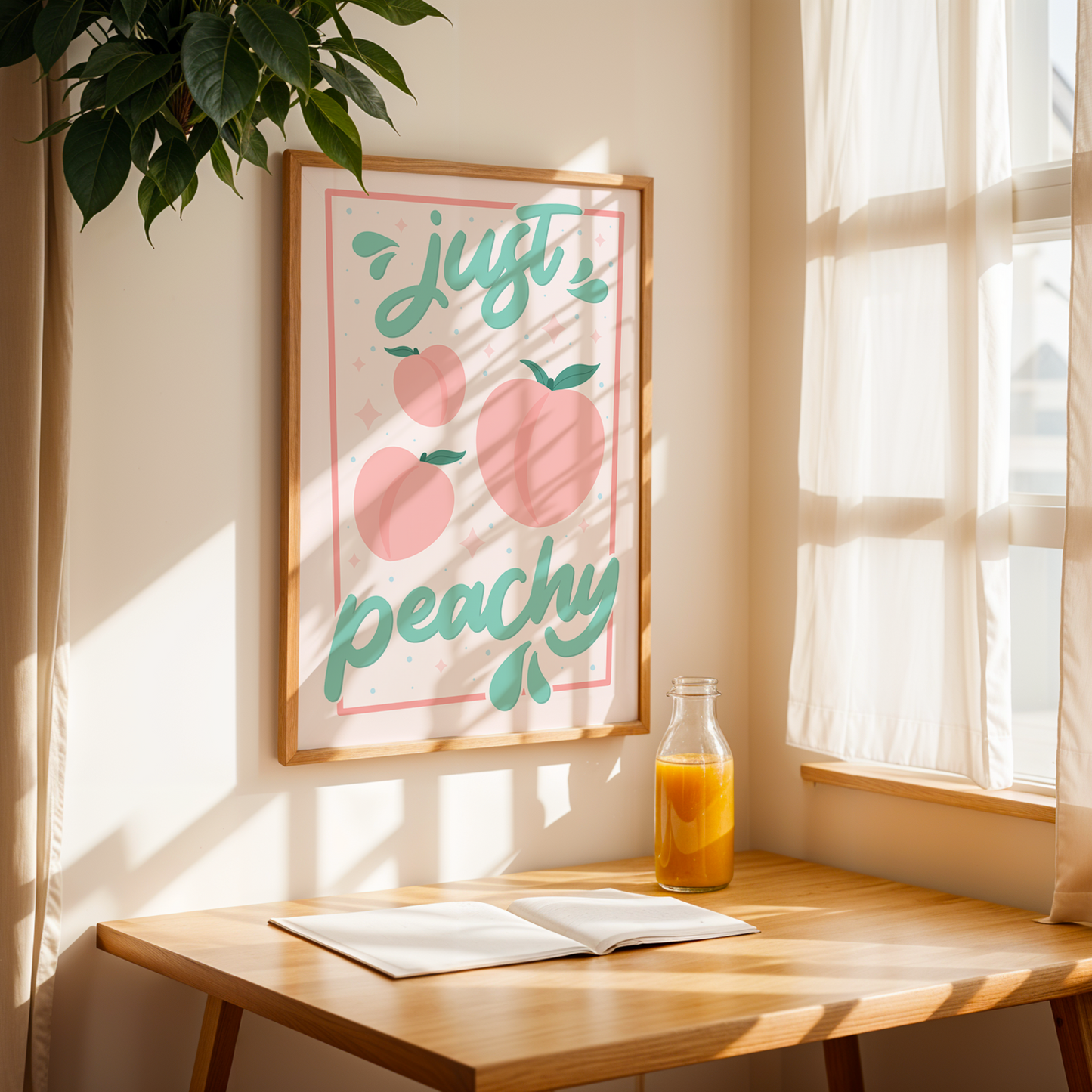 An art print with the text 'just peachy' hand-lettered in teal script, accompanied by illustrations of pink peaches and leaves, and a soft pink border.