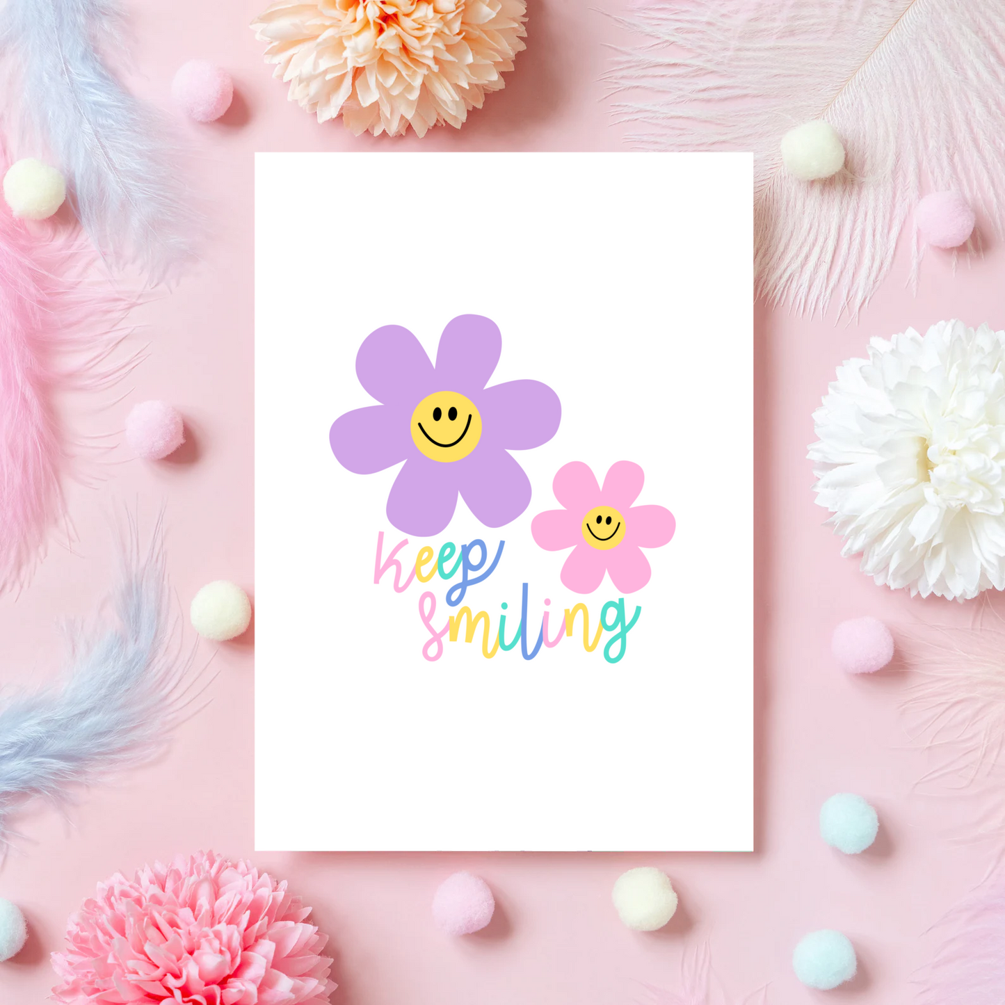 A card with two smiling flower illustrations and text that says 'keep smiling'.