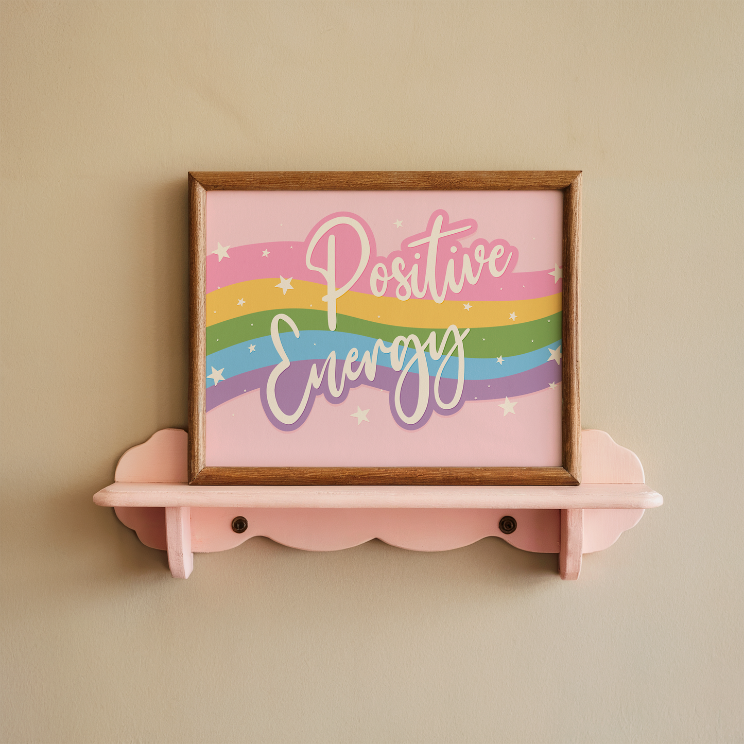 A bright print, with a pink, yellow, green blue and purple wave across the centre and the words 'positive energy' hand written in white across the top.