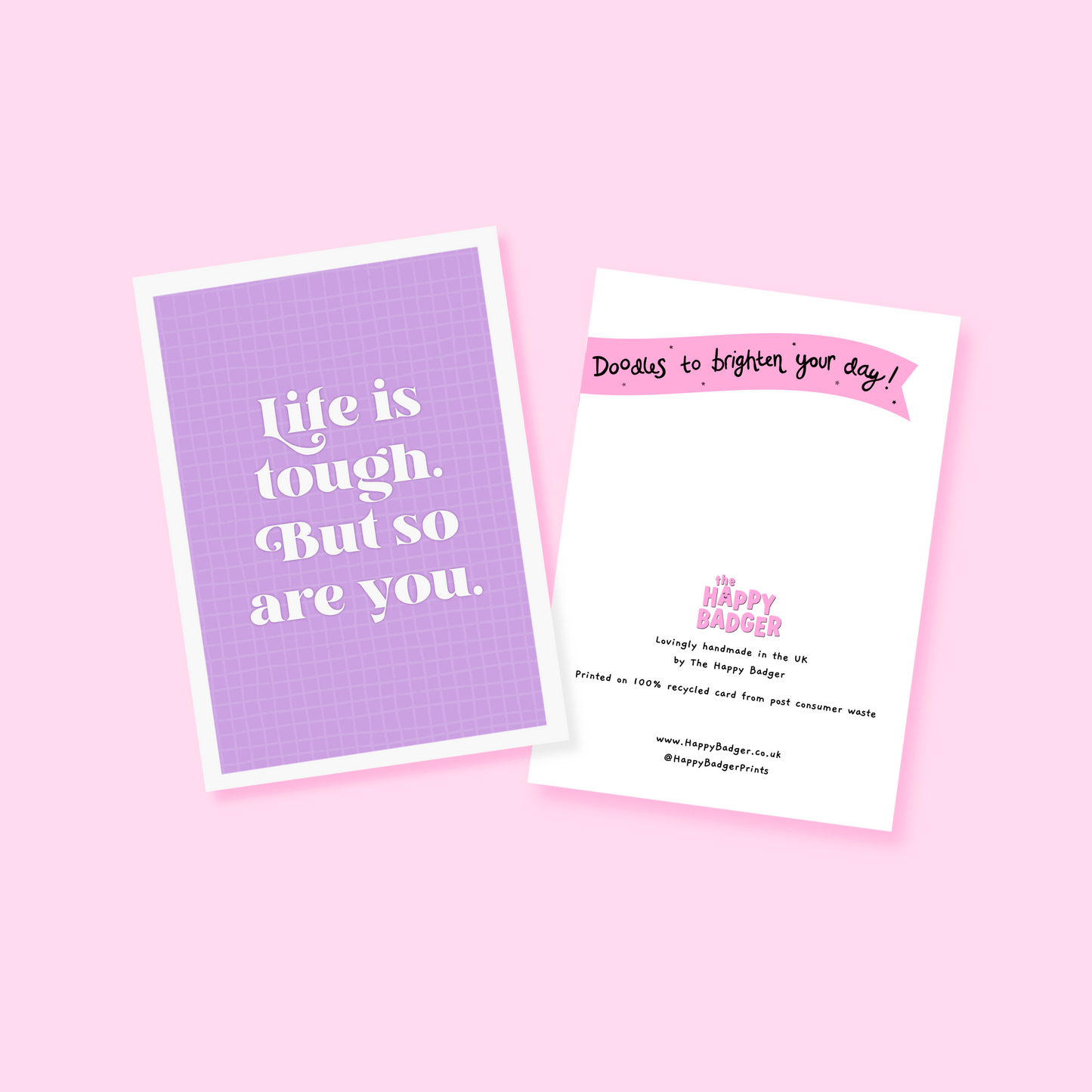 A purple card, with the quote 'life is tough, but so are you' on the front.