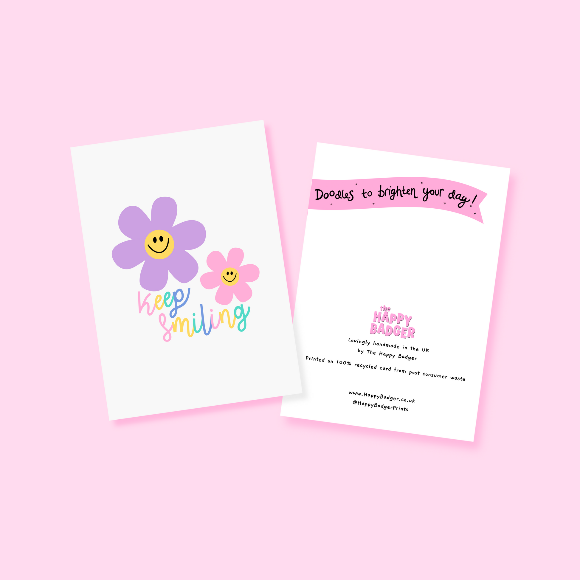 A card with two smiling flower illustrations and text that says 'keep smiling'.