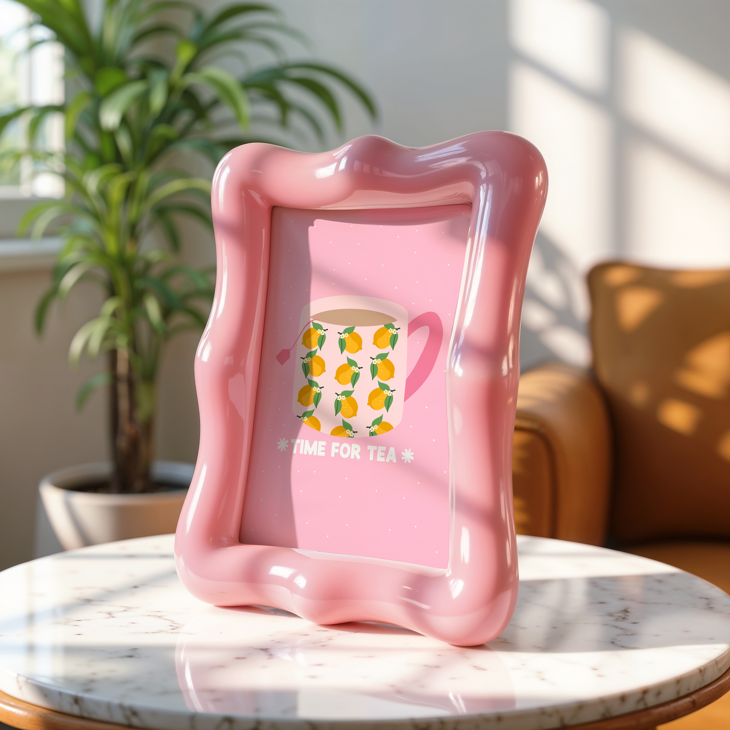 A pink print, with an illustration of a mug filled with tea. The mug has a lemon pattern on it and a pink handle. Underneath the mug are the words 'time for tea', written in white text.