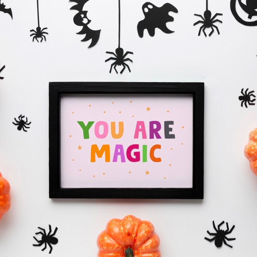 A colourful quote print that reads 'YOU ARE MAGIC' in bright and bold Halloween themed colours.