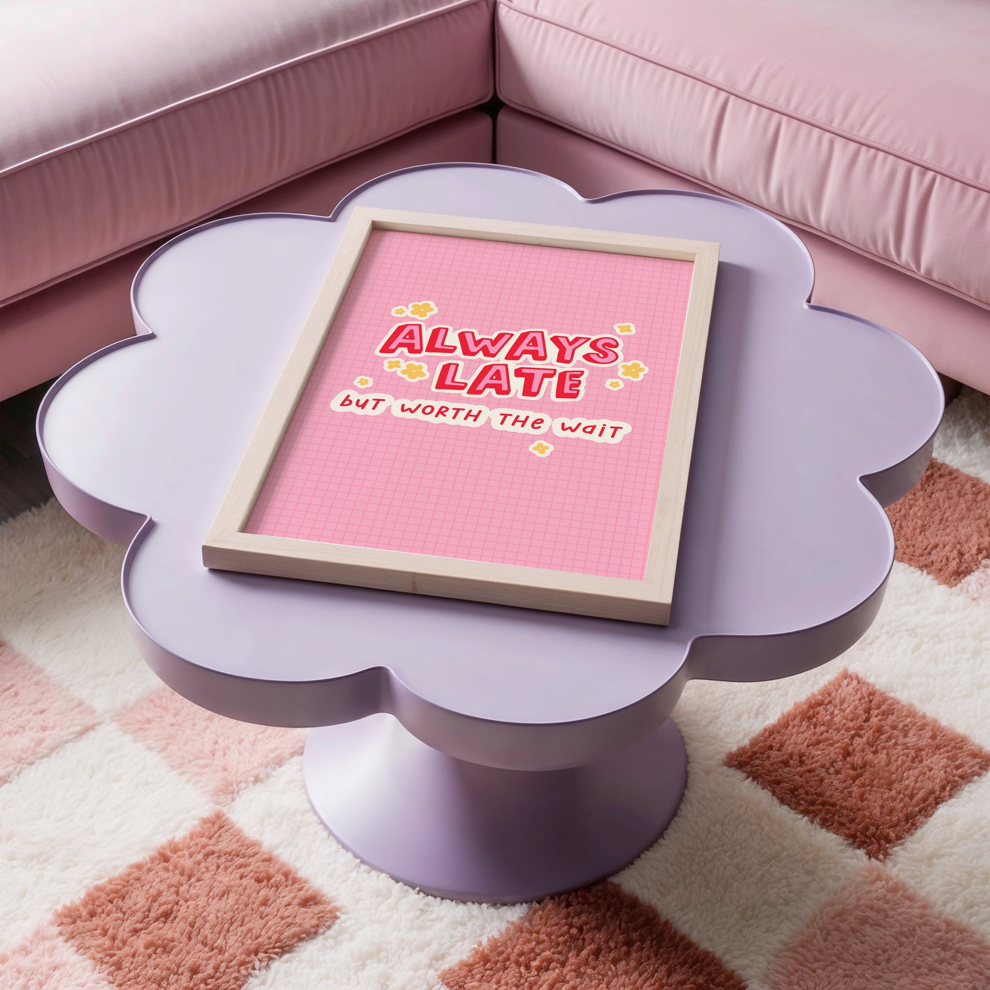 A colourful pink print with a quote saying always late but worth the wait in a contrasting red font.