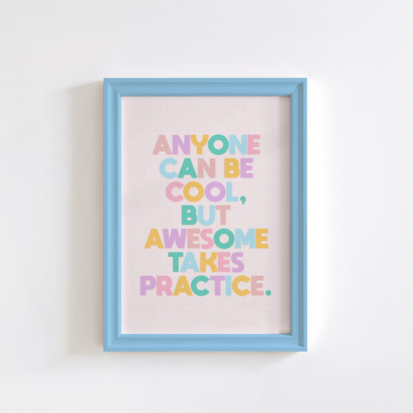 A typography print with a funny motivational quote on, in vibrant colours, shown in a frame.