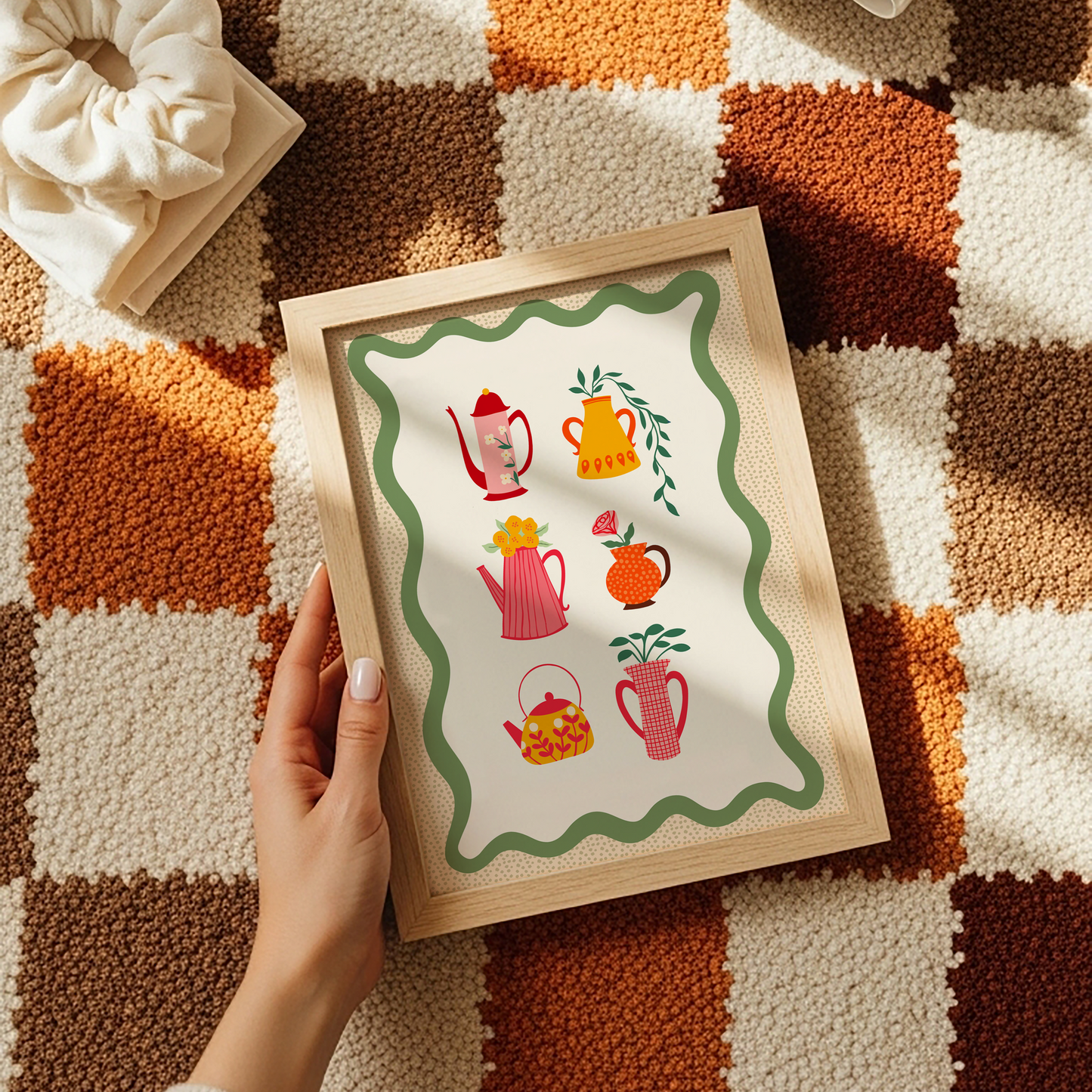 Illustrations of different colourful pots and vases with floral patterns or flowers in them, sat on a cream background with a green wavy border.