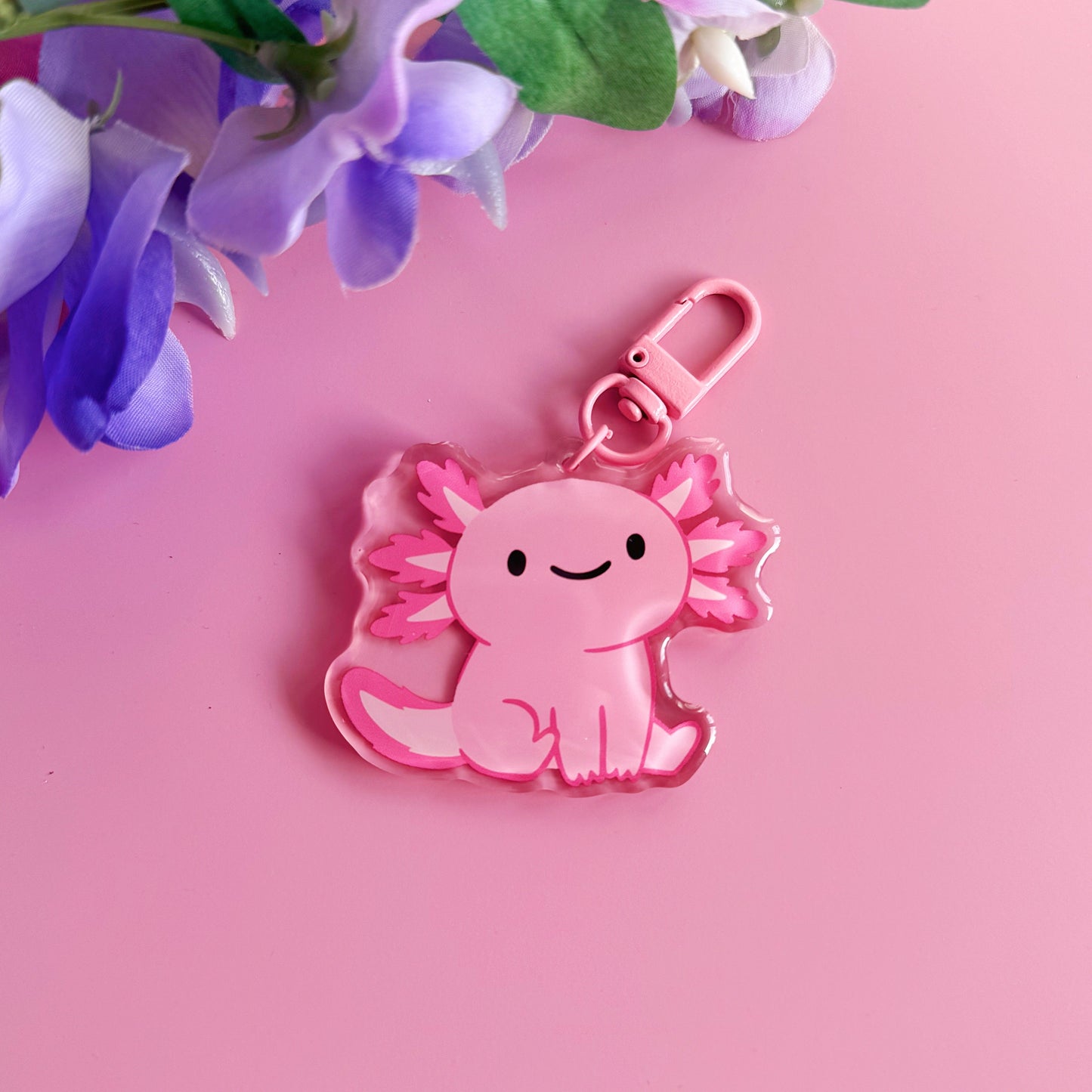 A pink axolotl keyring, with a coordinating pink clasp.