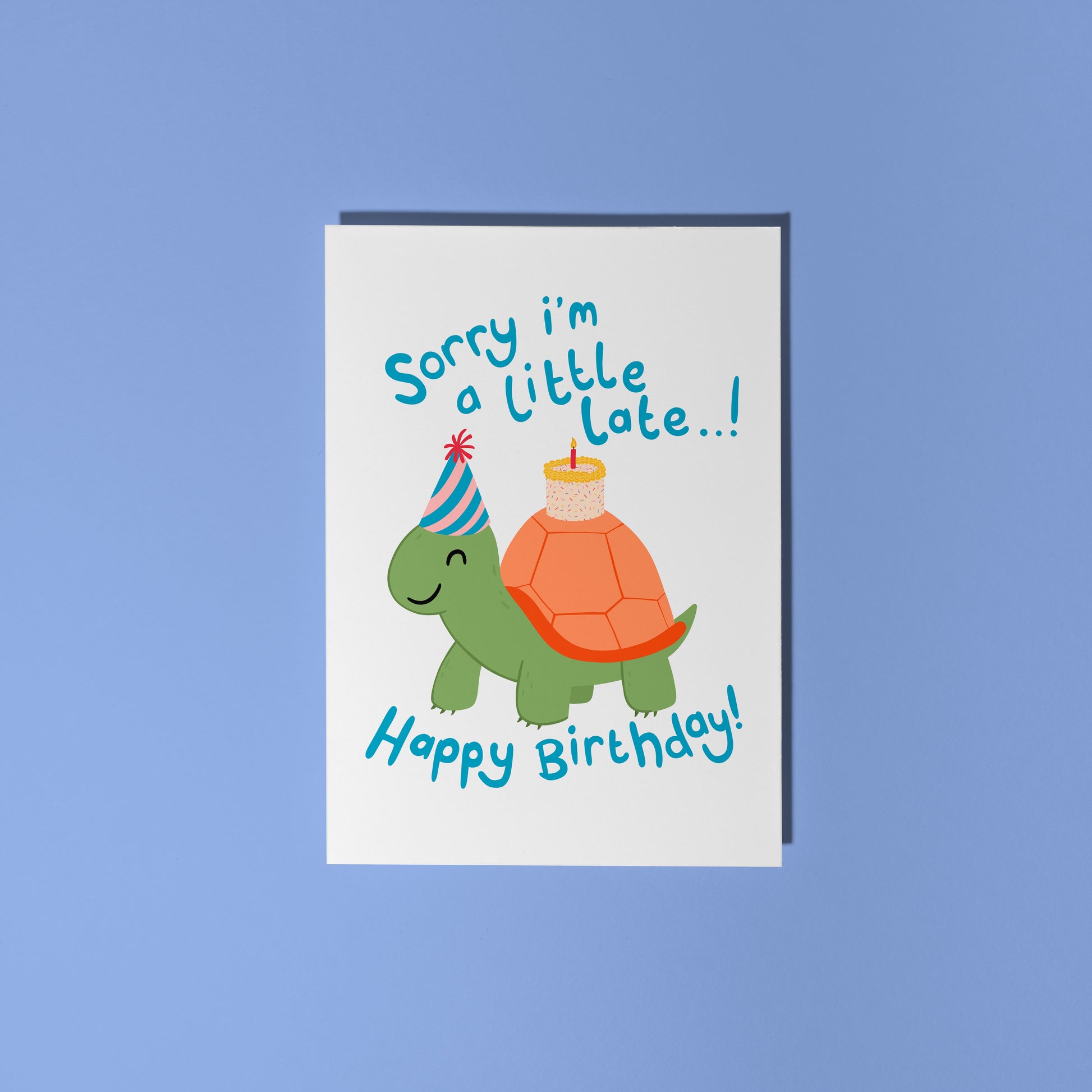 Birthday card with a tortoise wearing a party hat and text on a blue background
