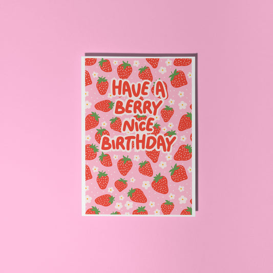 A card with a strawberry pattern, and text that reads 'have a berry nice birthday' in red.