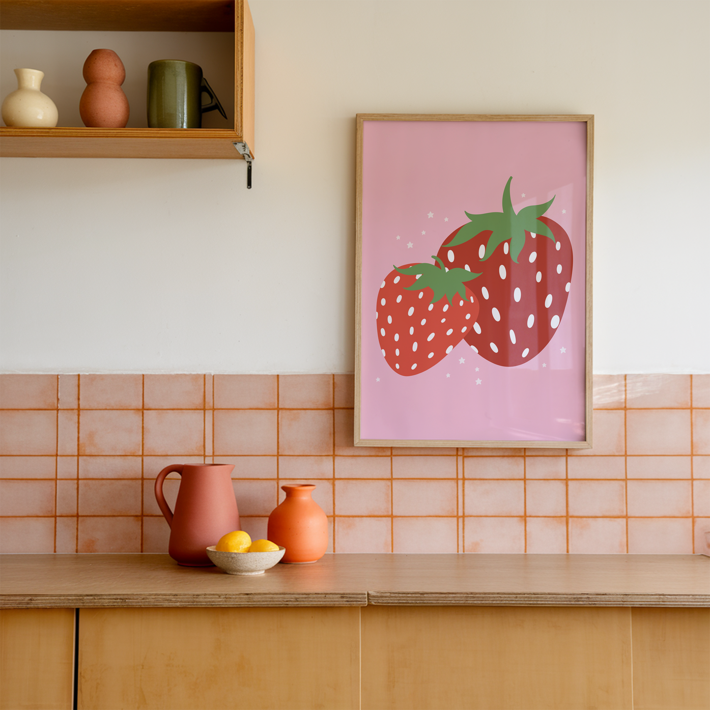 Kitchen with a strawberry-themed poster on the wall, colorful tiles, and kitchenware.