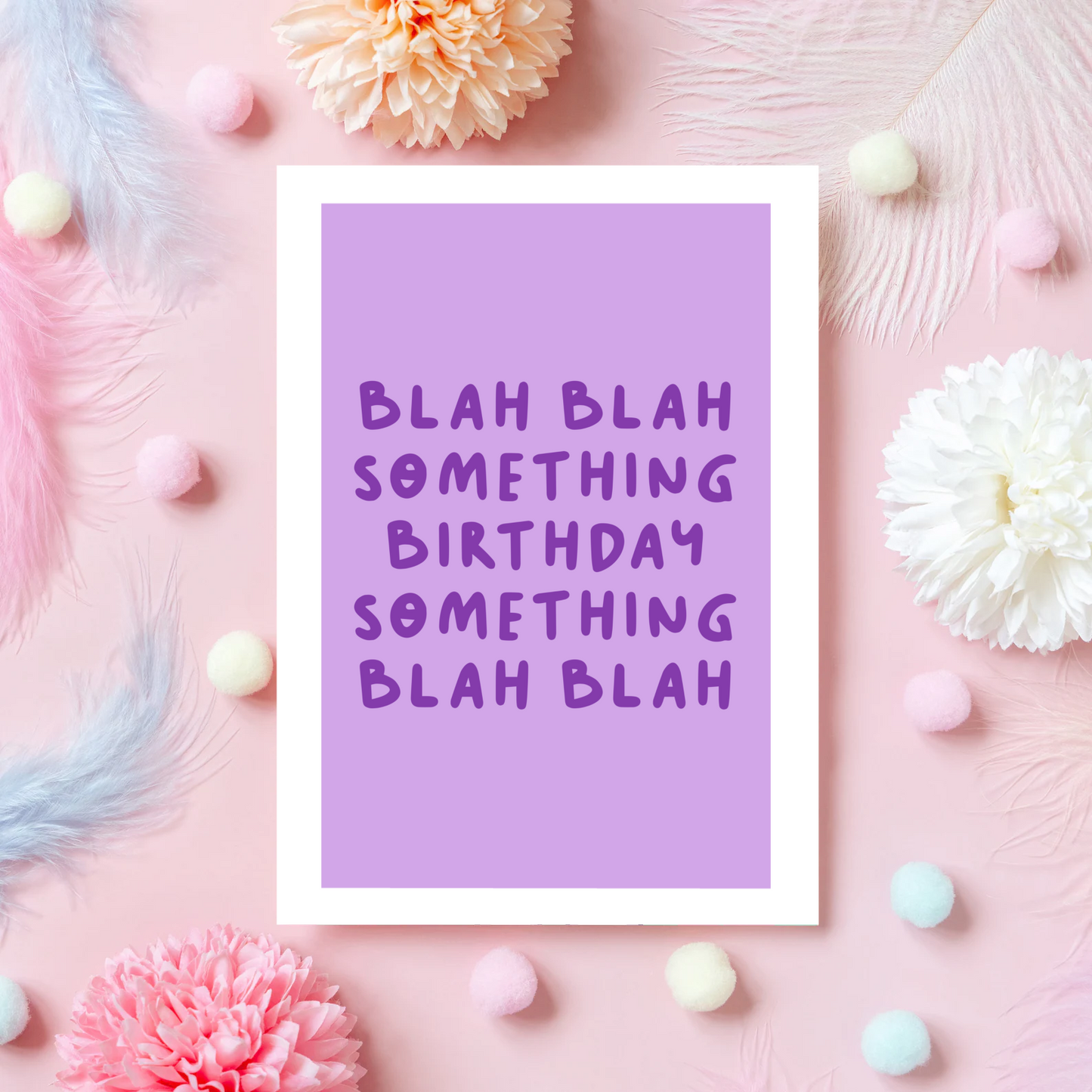 A birthday card, in purple, saying blah blah something birthday something blah blah