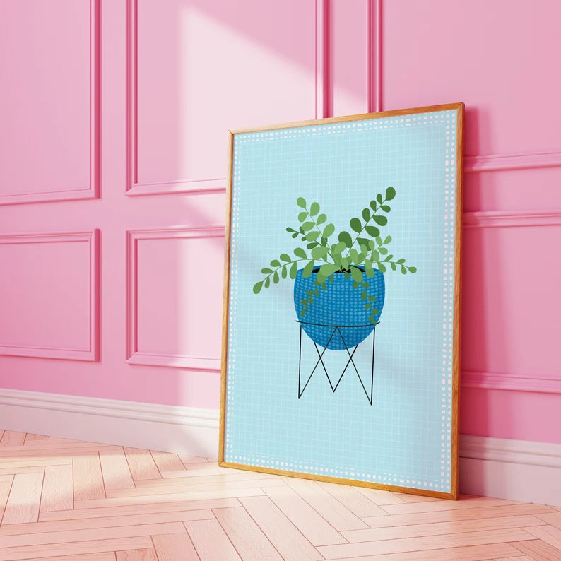 An illustration of a house plant in a blue plant pot, on a light blue textured background.