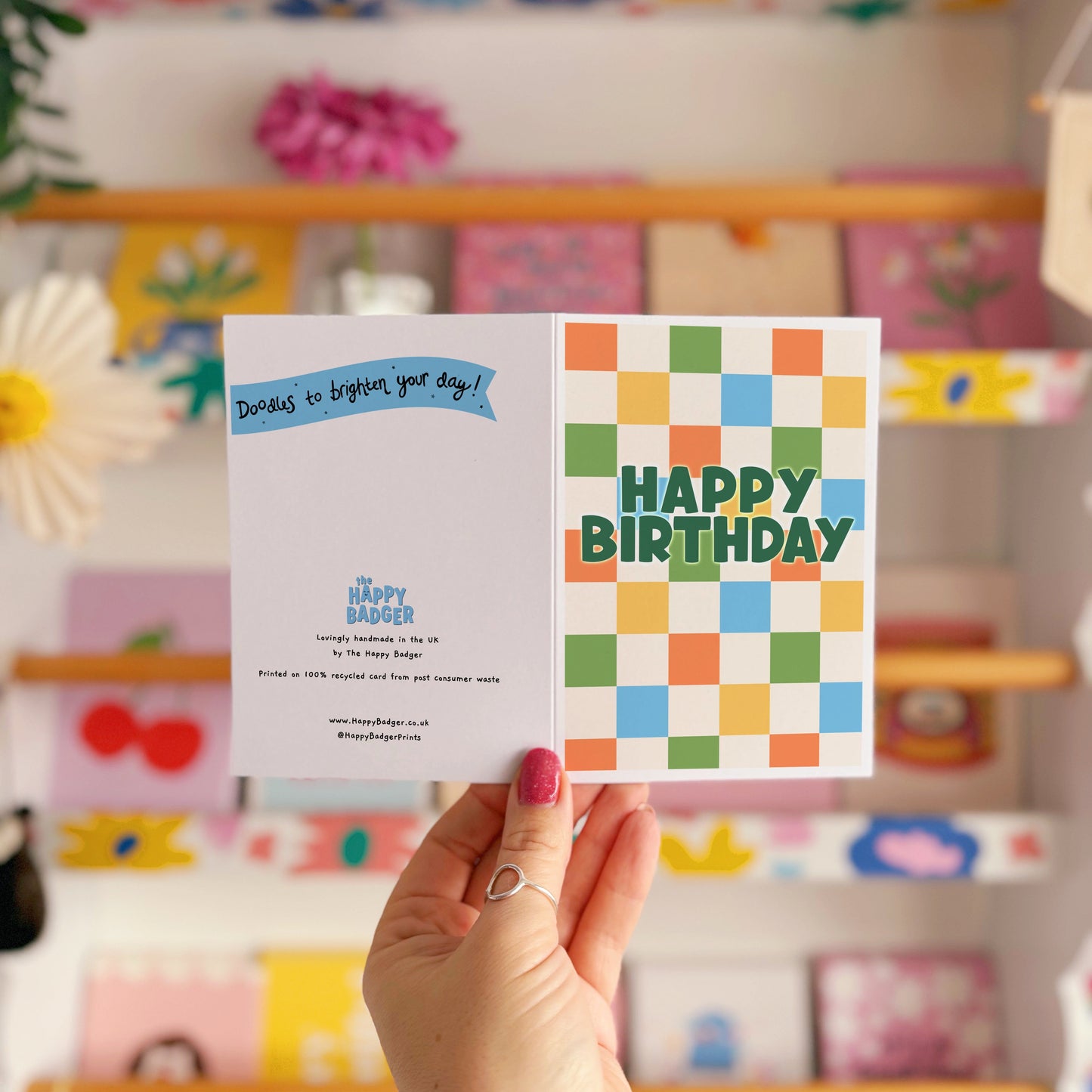 Happy Birthday card with a colourful checkered background. 