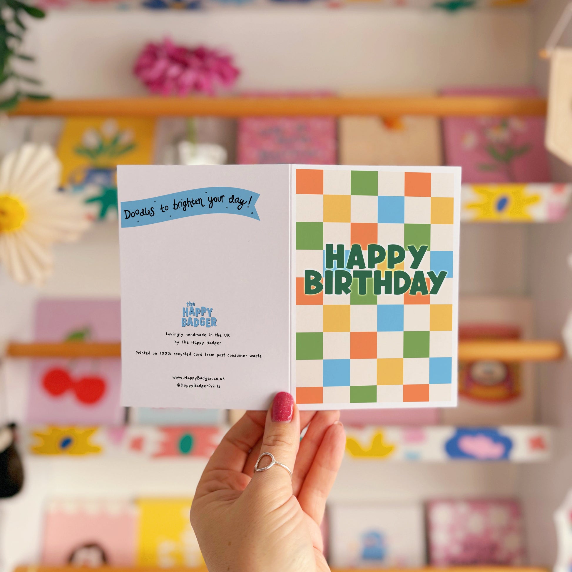 Happy Birthday card with a colourful checkered background. 