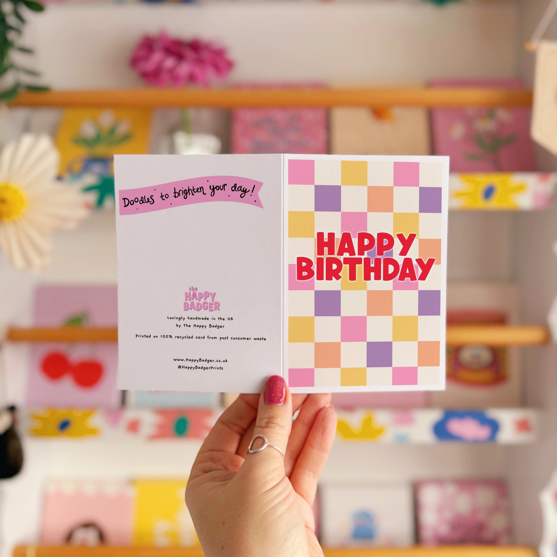 Happy Birthday card with a colourful checkered background. 