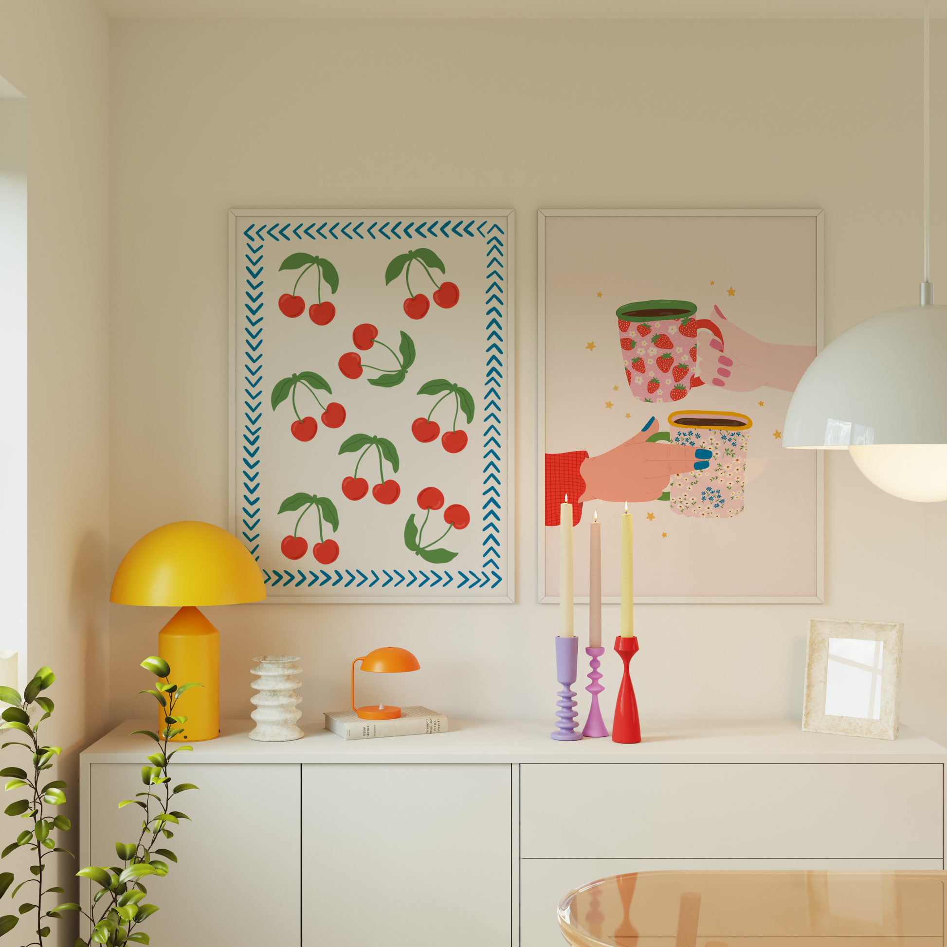 A print with red cherries all over it, and a blue chevron border, on a white background. Shown next to a print with two illustrated hands holding patterned mugs.