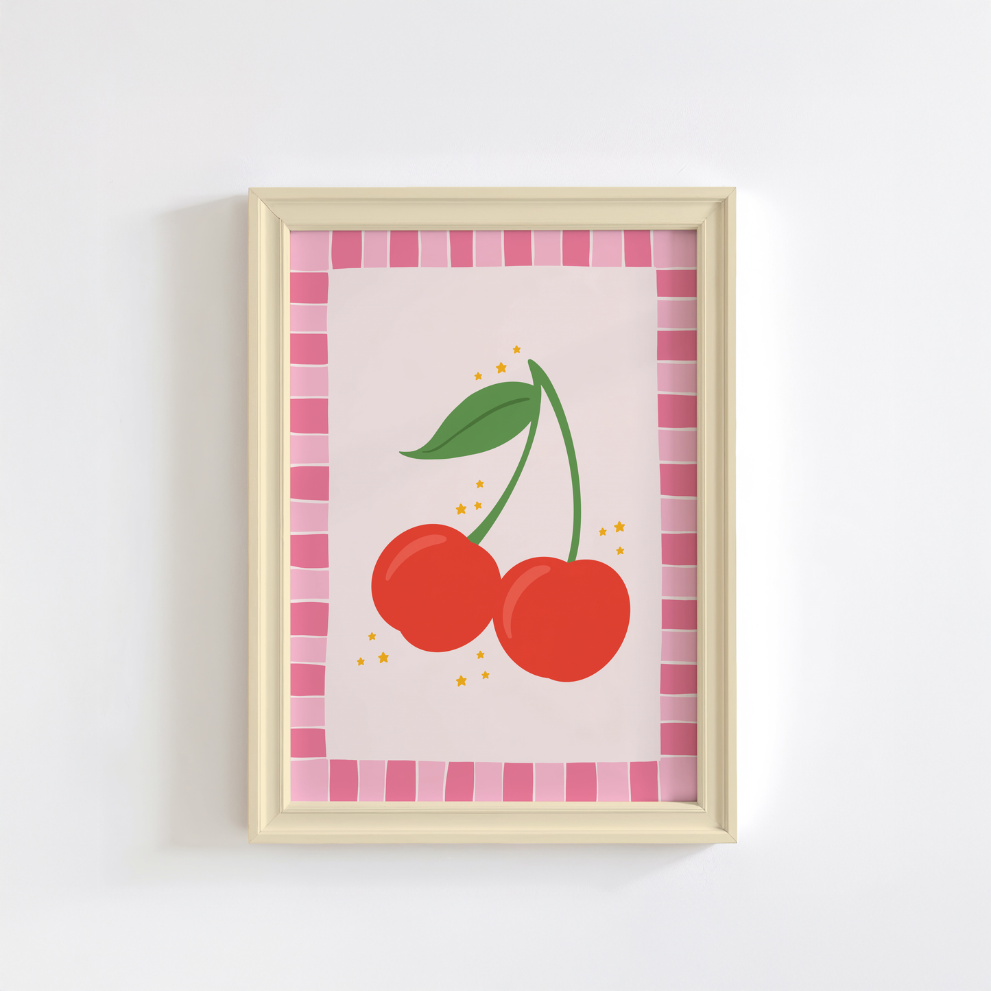 A print with an illustration of a pair of cherries, on a soft pink background surrounded by a bright pink hand drawn border.