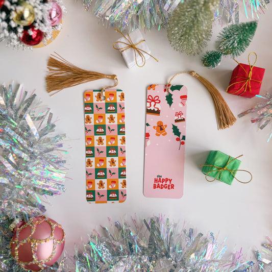 A Christmas-themed bookmark on a decorative surface with tinsel and ornaments.