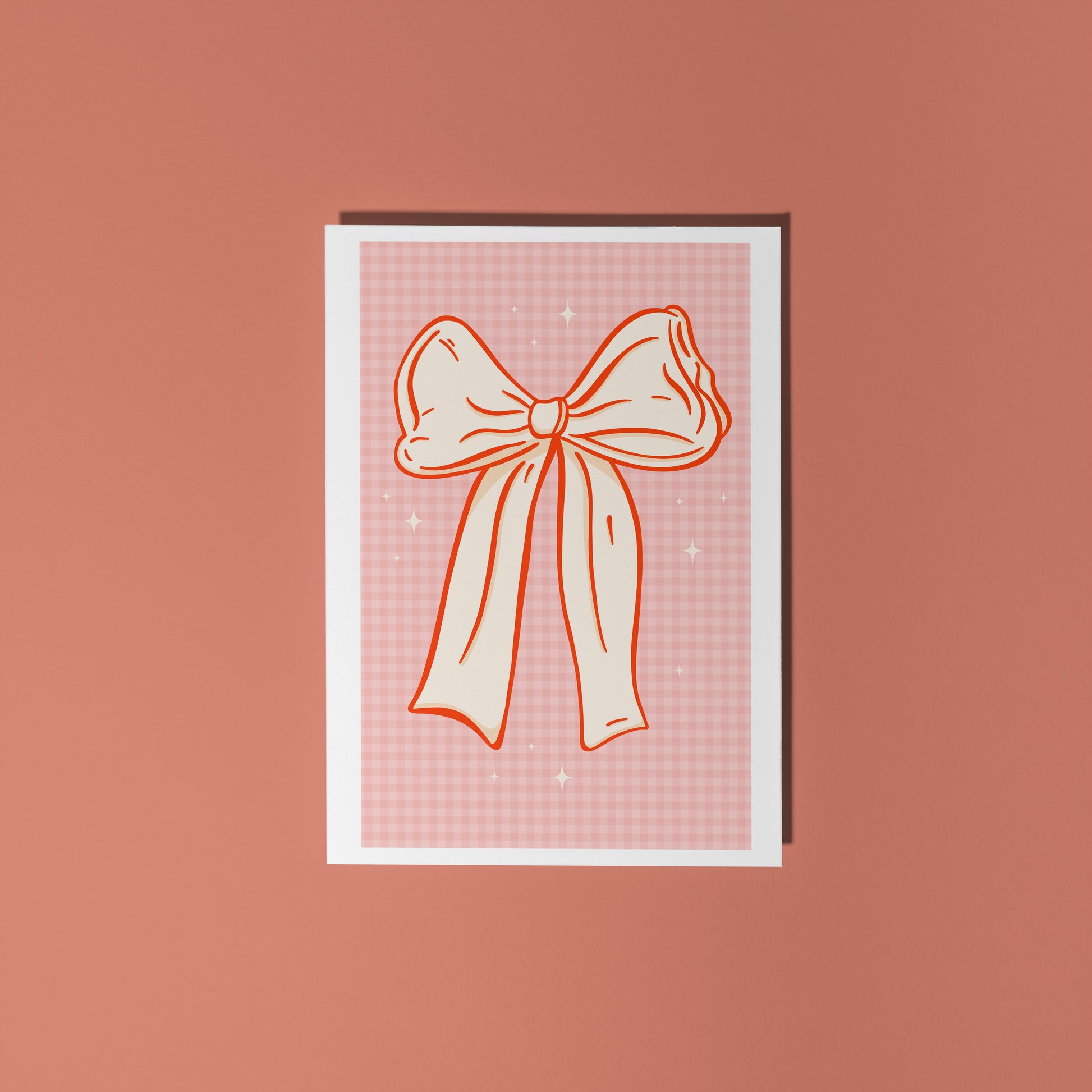 Card with a bow design on a pink background