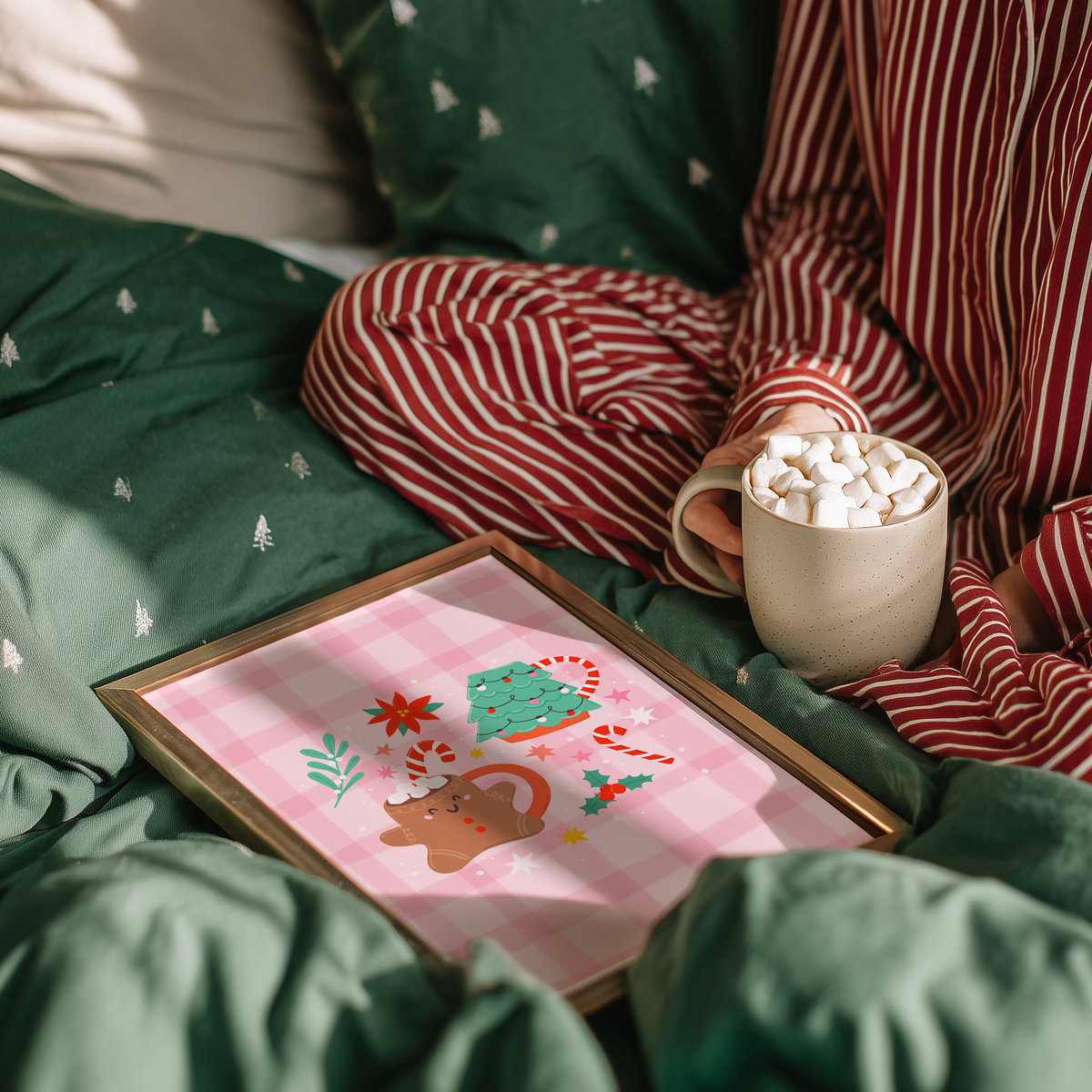 An illustrated Christmas print featuring two Christmas mugs - one a gingerbread person, and one a Christmas tree shaped mug. The mugs are surrounded by Christmas themed doodles.