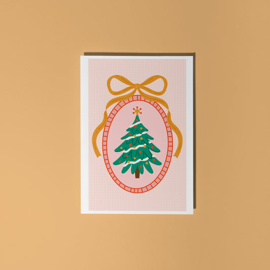 Greeting card with Christmas tree design on a beige background