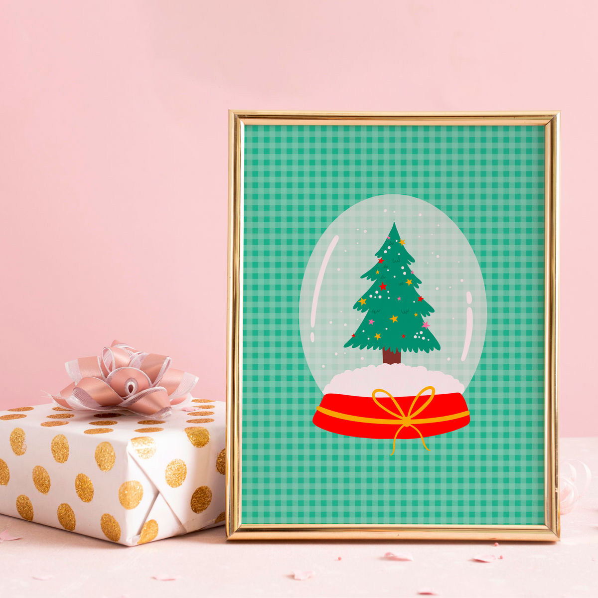 An illustrated Christmas print, featuring a Christmas tree inside a snow globe, set on a green gingham background.