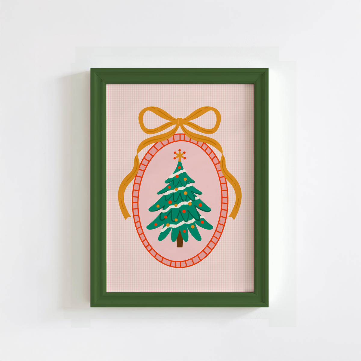 An illustration of a Christmas tree, surrounded by a hand drawn border with a large golden bow on top. The background of the print is a warm pink gingham.