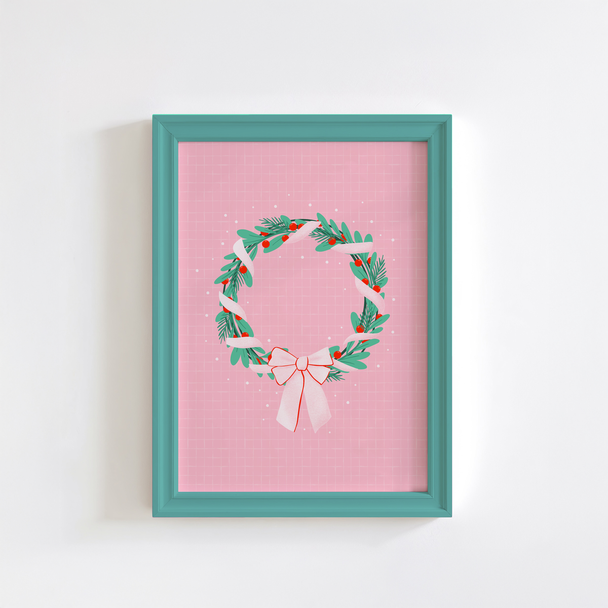 A bright pink christmas print featuring an illustration of a wreath wrapped in ribbon.