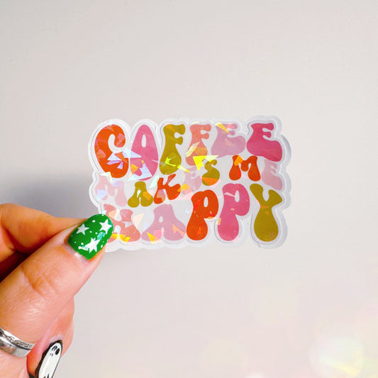 A holographic sticker, of the words coffee makes me happy in bubble writing. The sticker has an easy peel lip.