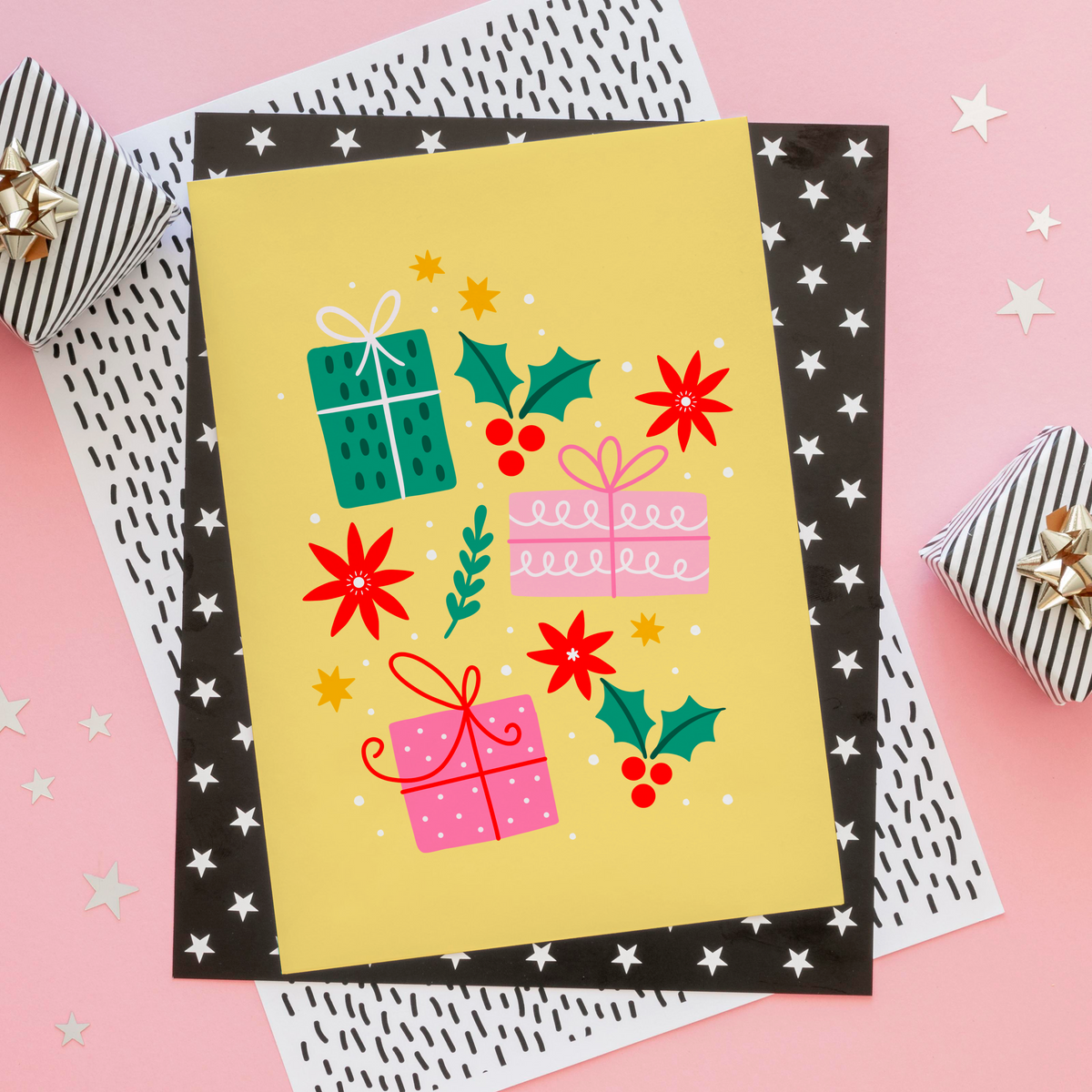 A yellow Christmas print with three brightly wrapped presents, and other small festive themes doodles.