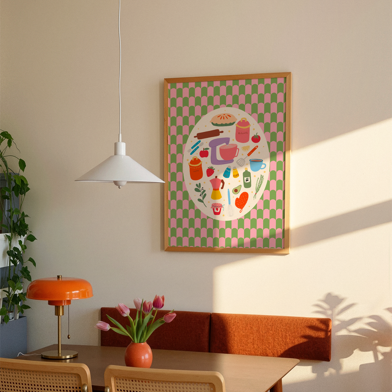 A bright print with a green and pink patterned background, with a cream oval in the centre. Inside the oval are lots of different kitchen themed illustrations, like food and utensils.