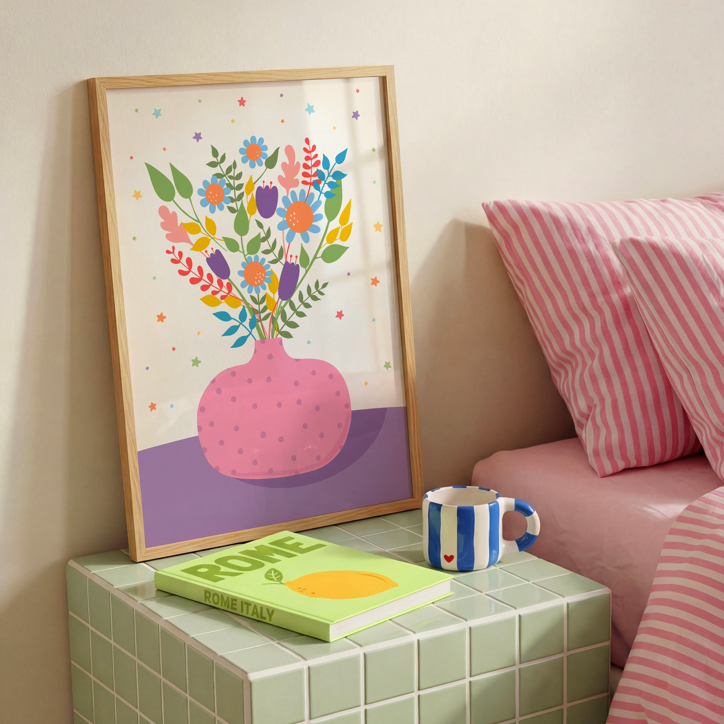 An illustration of a pink vase with bright colourful flowers in. The vase is set on a purple and cream background, decorated with little colourful star illustrations.