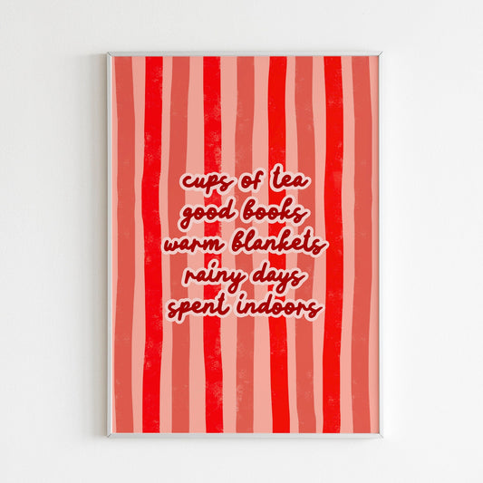 An cosy autumn quote print, on a red striped background, shown in a frame.