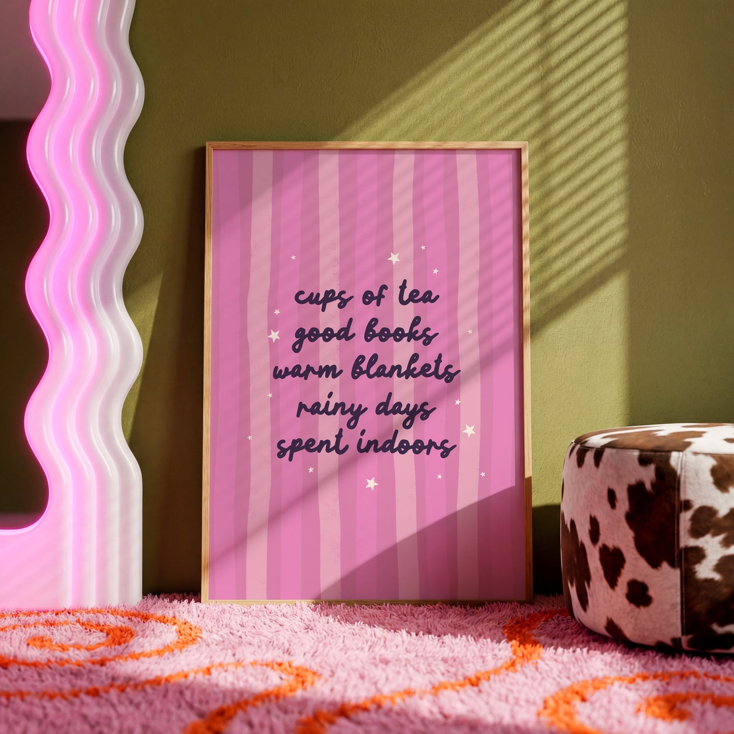 A purple striped background with a cosy quote about what makes a perfect cosy day indoors (tea, books, blankets and rain!)