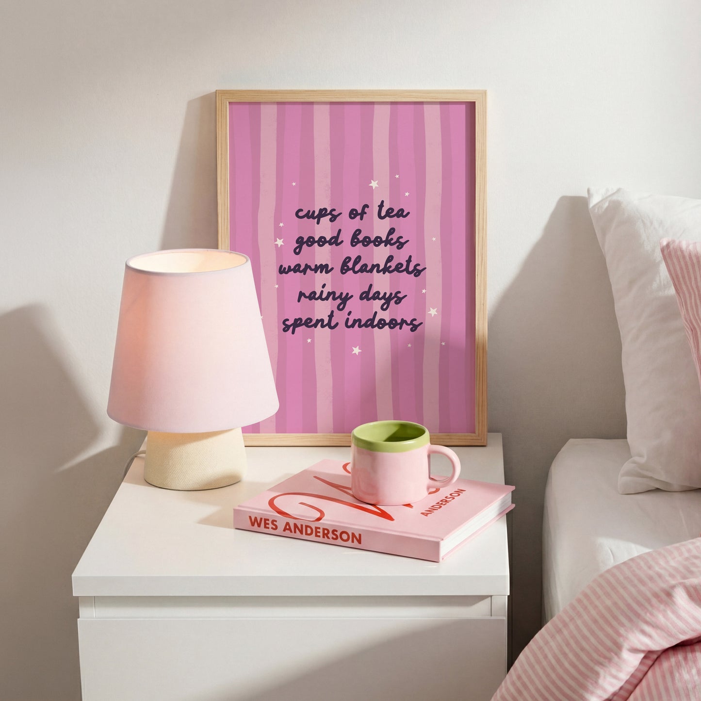 A purple striped background with a cosy quote about what makes a perfect cosy day indoors (tea, books, blankets and rain!)