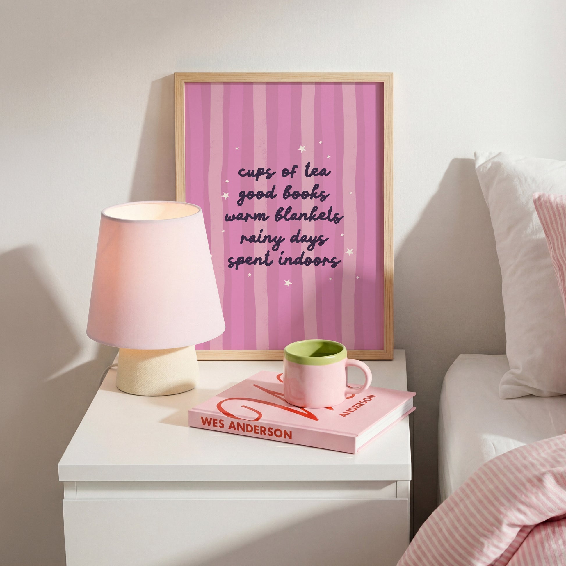 A purple striped background with a cosy quote about what makes a perfect cosy day indoors (tea, books, blankets and rain!)