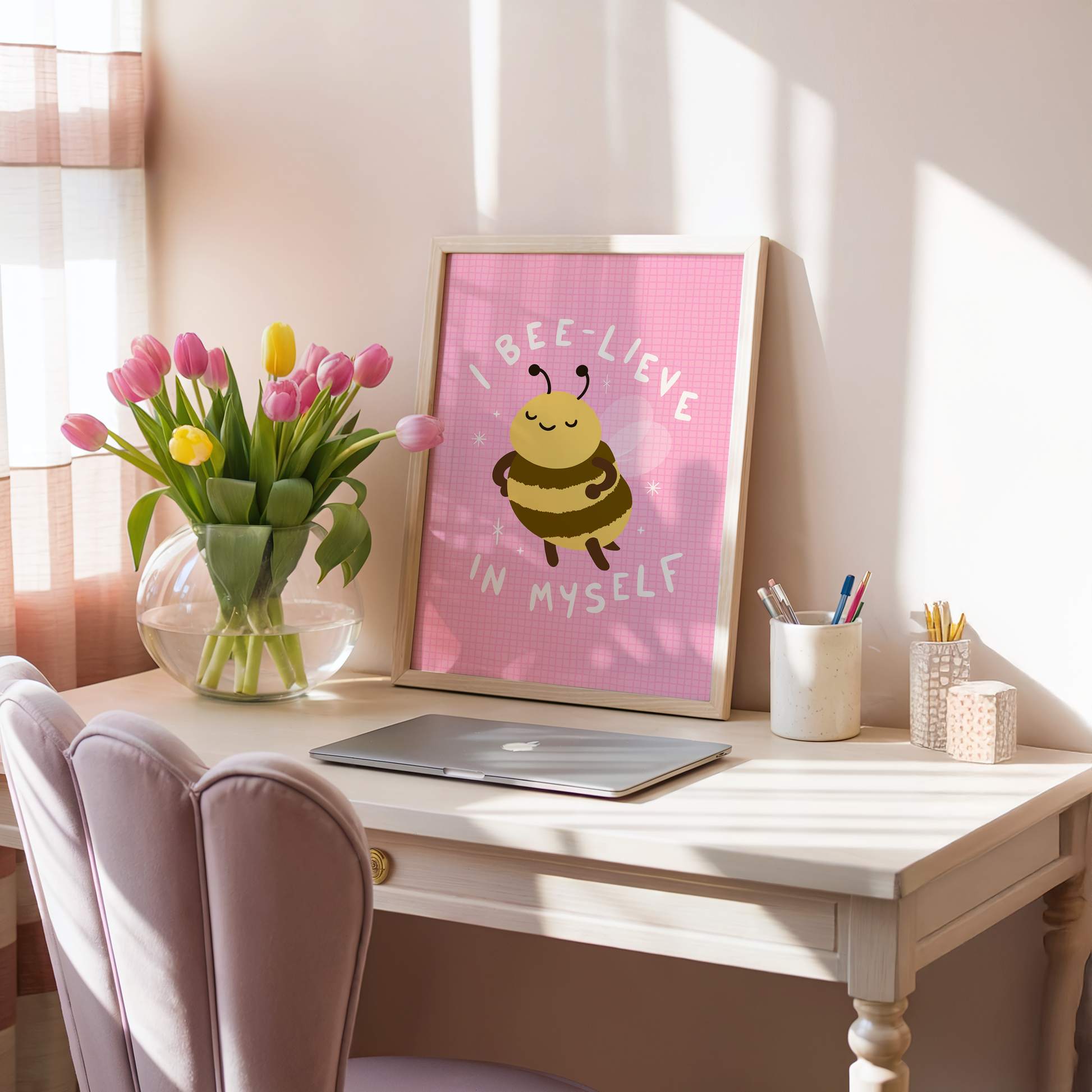 A pink print with an illustration of a cute little bumble bee, and hand written text that reads 'I believe in myself'.