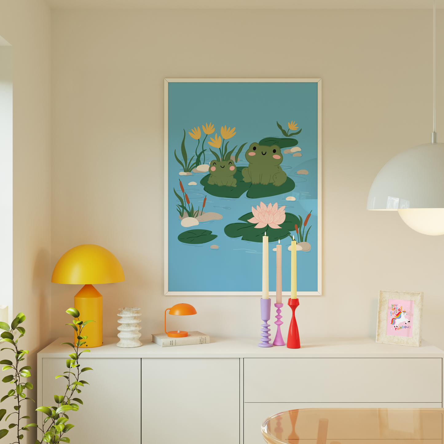 An illustration print of two frogs sitting on a Lilly pad, surrounded by flowers and other Lilly pads in a pond.
