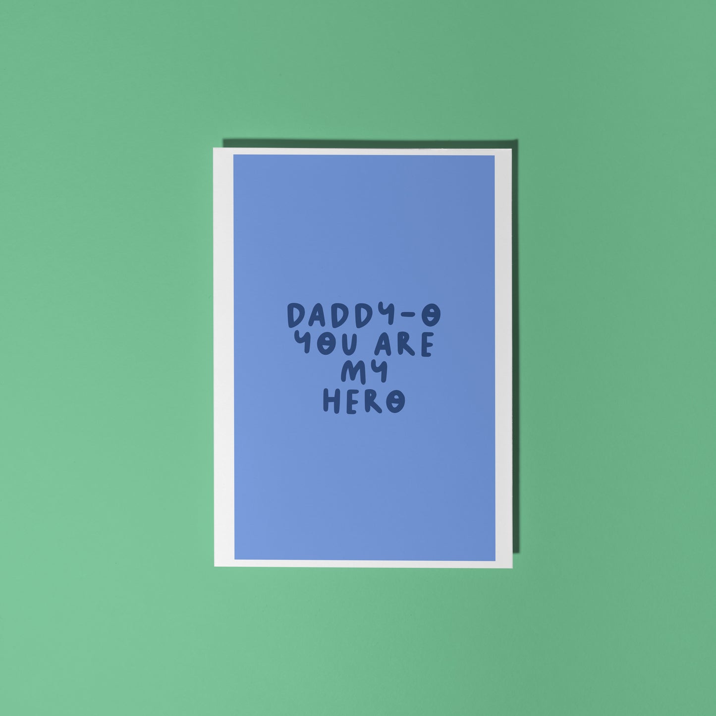A blue fathers day card, with text that reads 'Daddy-o you are my hero'.
