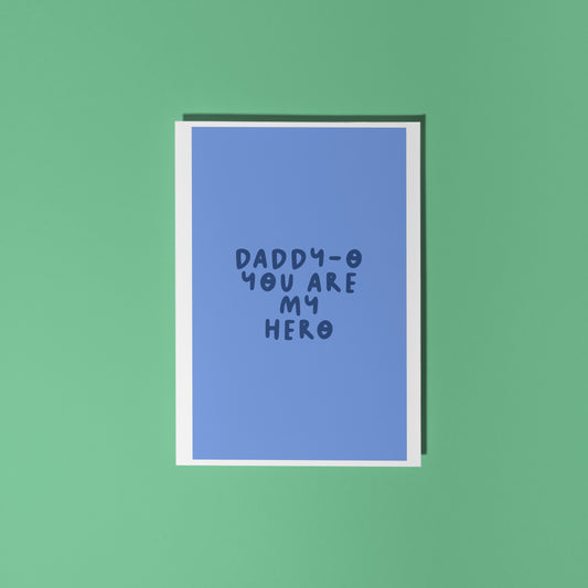 A blue fathers day card, with text that reads 'Daddy-o you are my hero'.