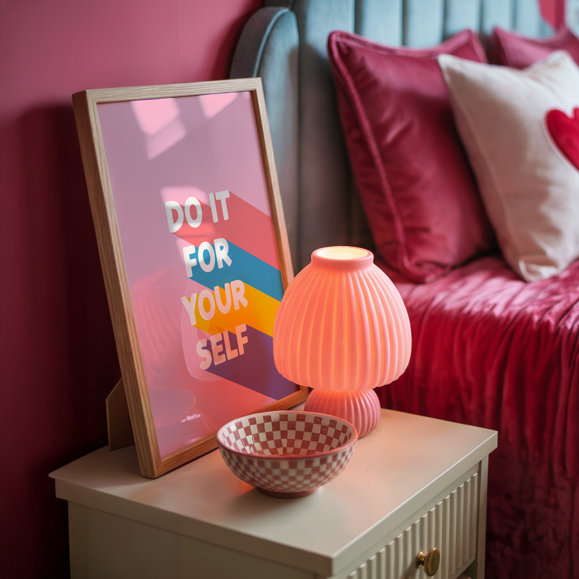 Framed poster with the words 'Do It For Yourself' on a pink background, with bright coloured stripes behind the text.