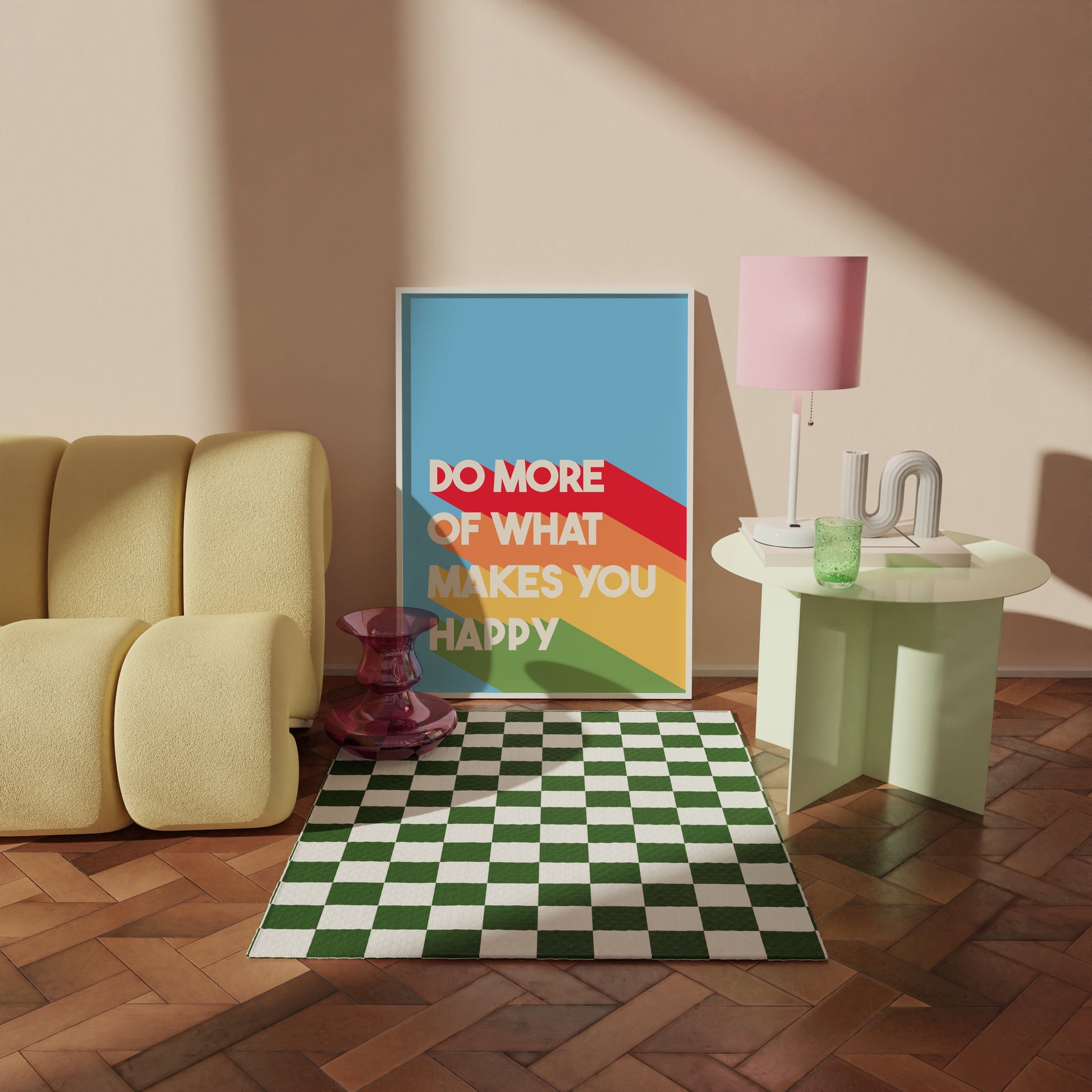 A colourful print, featuring a blue background and white text saying 'do more of what makes you happy' with bold stripes of red, orange, yellow and green behind the text.