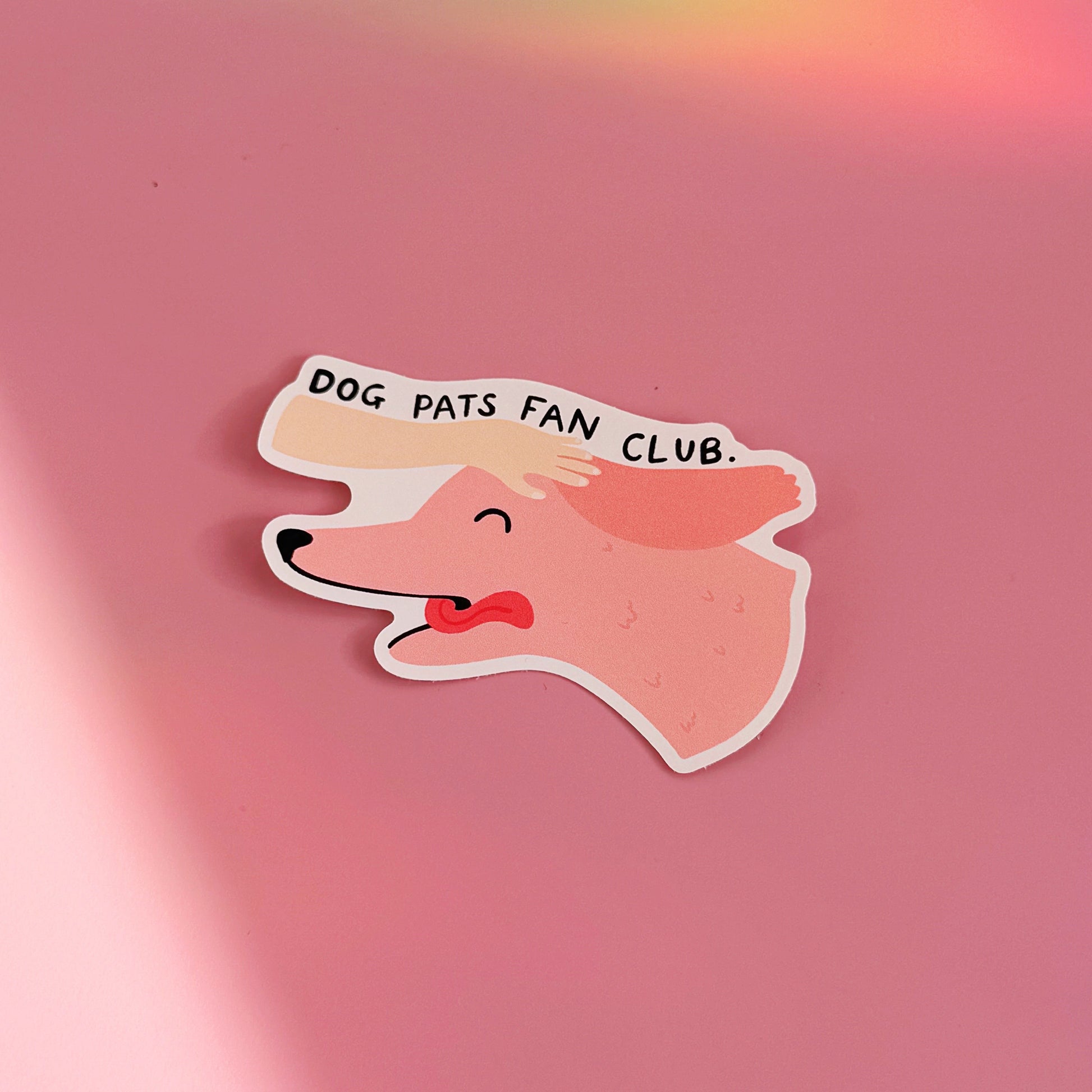 A waterproof sticker featuring an illustration of a dog with its tongue out and a hand patting its head. The text reads 'dog pats fan club'.