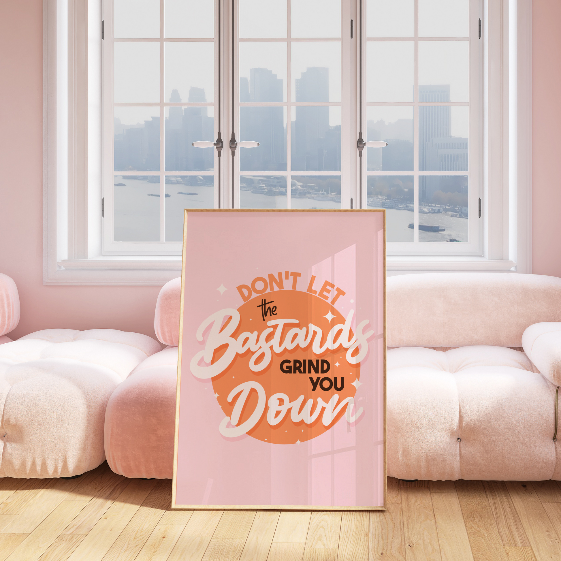 A bright pink and orange print showing a funny quote - don't let the bastards grind you down.
