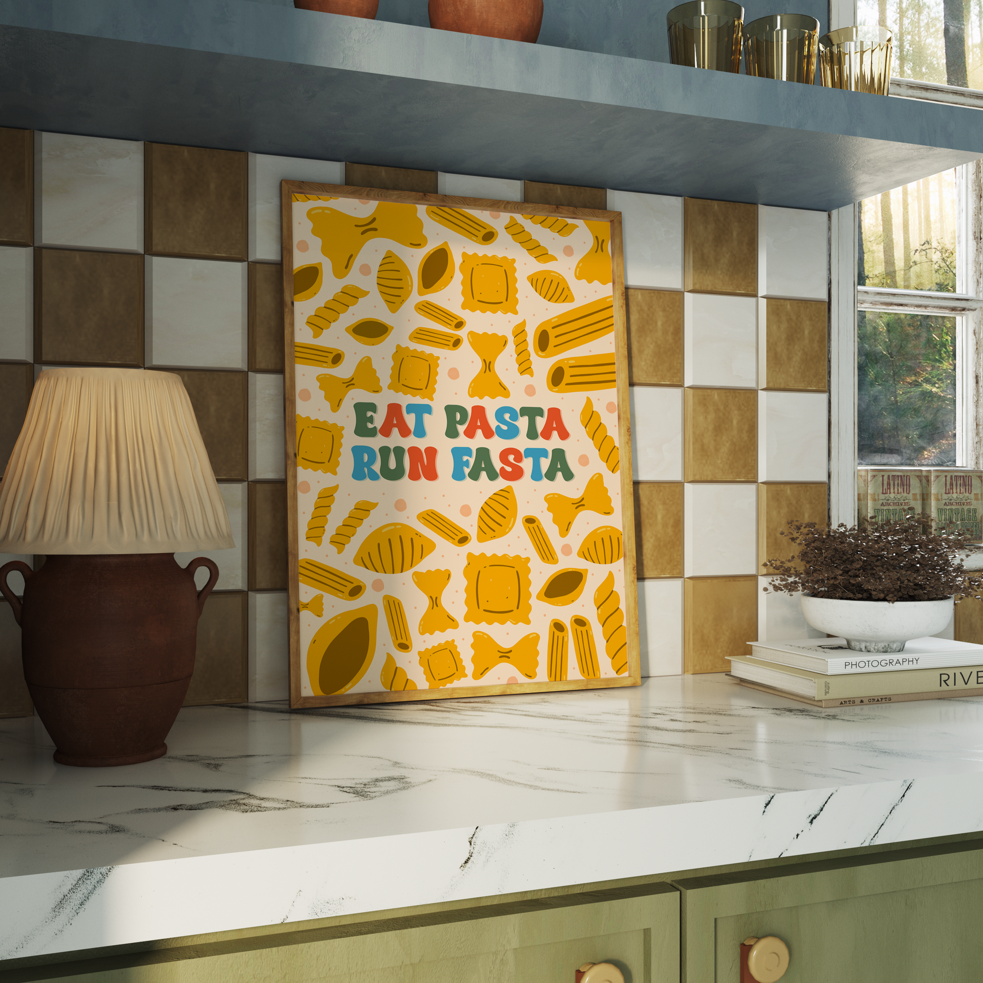 A colourful kitchen print with illustrations of different types of pasta, and a quote that reads 'eat pasta run fasta'.