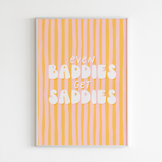 A funny quote print saying Even Baddies Get Baddies Print on a yellow and pink striped background.