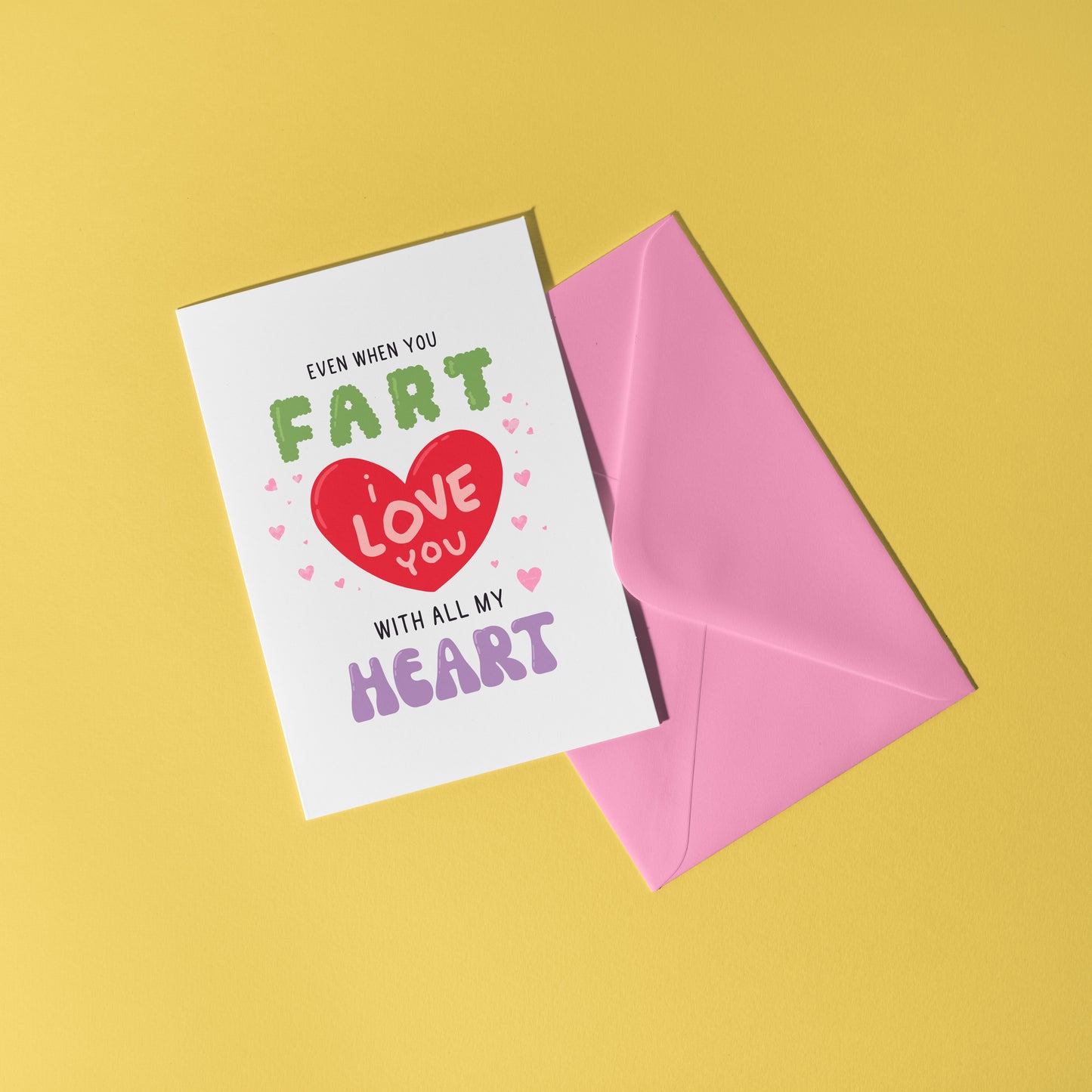 A funny quote love themed card, that says 'even when you fart, I love you with all my heart, in hand drawn lettering.