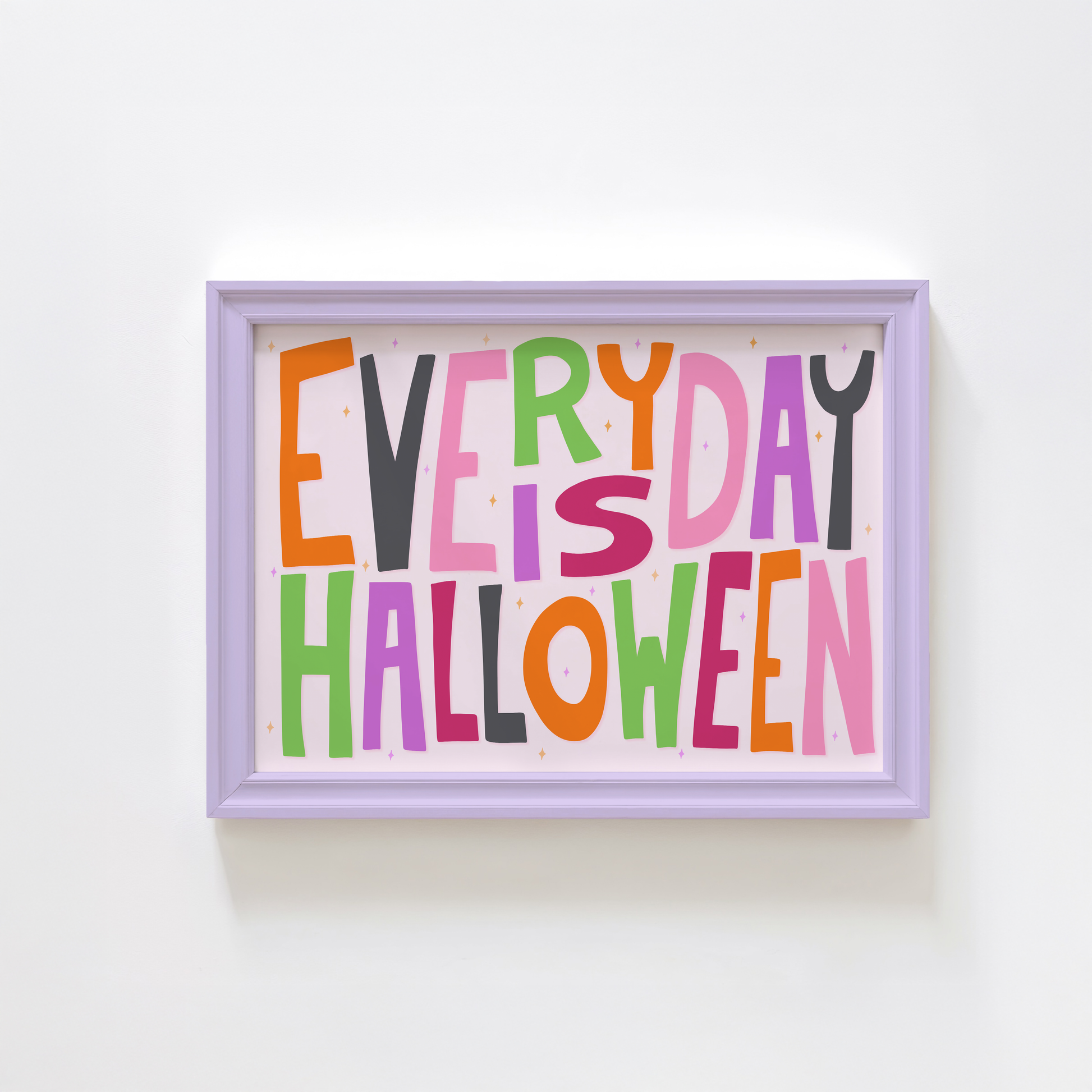 A typographic wall art piece reading “EVERY DAY IS HALLOWEEN” in colourful letters.